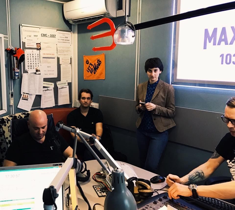 Maria in a radio studio with a band